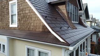 Colonial Brown Interlock Cedar Shingle aluminum roof on a colonial style home with a metal roof in a suburban area, La Grange, Illinois