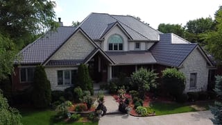 Tudor Brown Interlock Tile aluminum roof on a Tudor-style home with a Tudor Brown metal roof in a, Lemont, Illinois
