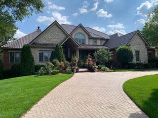 Tudor Brown Interlock Tile aluminum roof on a Tudor Brown metal roof on a colonial style home in a, Lemont, Illinois