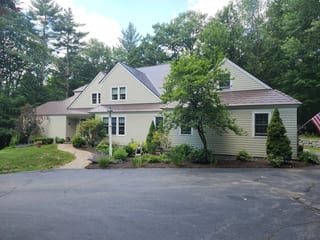 Colonial Brown Interlock Shingle aluminum roof on a Colonial-style home with Colonial Brown metal roof among, Kennebunk, Maine