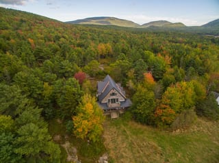 Deep Charcoal Interlock Cedar Shingle aluminum roof on a deep charcoal metal roof on a two-storey A-Frame home, Bar Harbor, Maine