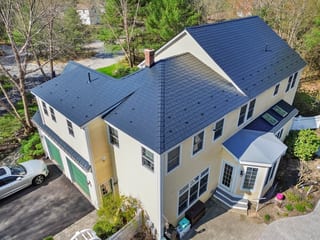 Black Interlock Slate aluminum roof on a two-storey colonial home with a slate metal roof in, Brunswick, Maine