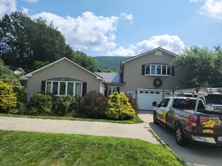 Colonial Brown Interlock Shingle aluminum roof being installed on a colonial home with a brown roof under construction in a, Clarksburg, Massachusetts