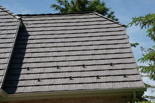 Weathered Interlock Shake aluminum roof on a single-family home with a metal roof in a forested urban, Mendota Heights, Minnesota