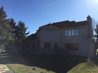 Before: a worn out wood shake roof on the home, Mendota Heights, Minnesota, ahead of a Weathered Interlock Shake aluminum roof