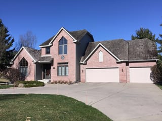 Before: a worn out wood shake roof on the home, Mendota Heights, Minnesota, ahead of a Weathered Interlock Shake aluminum roof