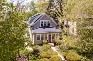 Deep Charcoal Interlock Slate aluminum roof on a two-storey craftsman home with a slate metal roof among, Minneapolis, Minnesota