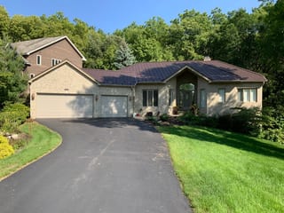 Colonial Brown Interlock Shake aluminum roof on a brown single-storey home with a brown metal roof in a, Bloomington, Minnesota