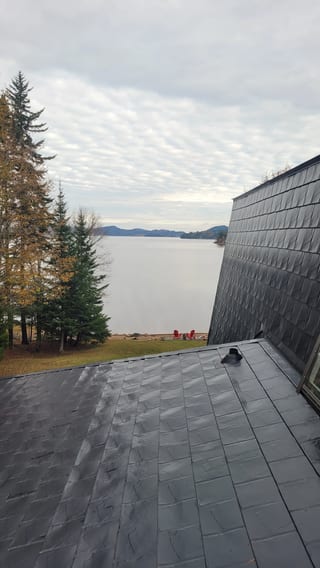 Black Interlock Slate aluminum roof on a waterfront home with a modern roof in Utopia, New, Utopia, New Brunswick