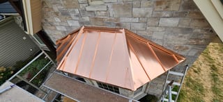 Deep Charcoal Interlock Slate aluminum roof on a beige home with dormers on a rural suburban lot, Sussex, New Brunswick