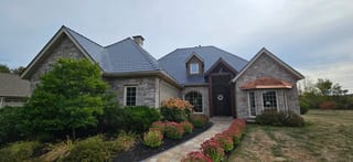 Deep Charcoal Interlock Slate aluminum roof on a ranch style single family home in a rural area, Sussex, New Brunswick