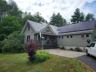 Tudor Brown Interlock Slate aluminum roof on a Tudor brown metal roof on a ranch style home among tall, Effingham, New Hampshire