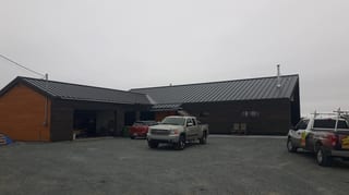 Deep Charcoal Interlock Standing Seam aluminum roof on the home, Cow Bay, Nova Scotia