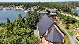 Black Interlock Slate aluminum roof being installed on the home, Lahave, Nova Scotia
