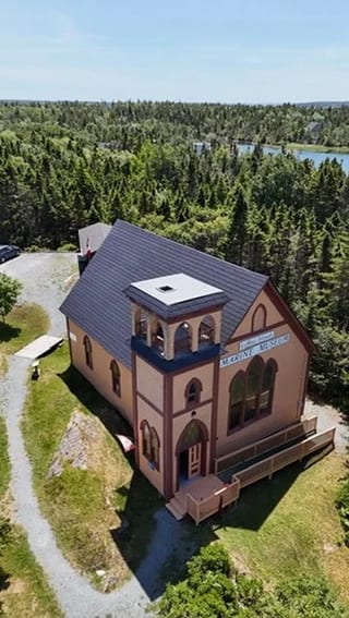 Black Interlock Slate aluminum roof on the home with chimney and roof louver, Lahave, Nova Scotia