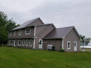 Tudor Brown Interlock Slate aluminum roof on the home, Canning, Nova Scotia