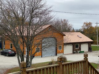 Copper Penny Interlock Cedar Shingle aluminum roof on the home with skylight, Arcadia, Nova Scotia