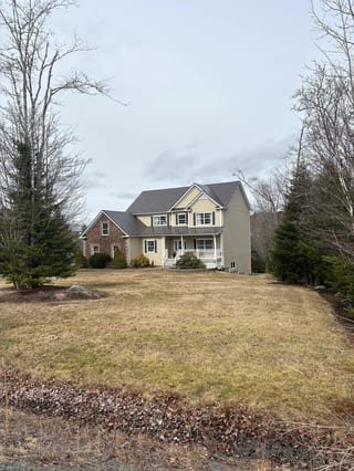 Tudor Brown Interlock Slate aluminum roof on the home, Fall River, Nova Scotia