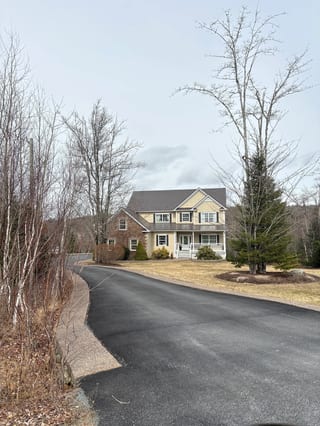 Tudor Brown Interlock Slate aluminum roof on the home, Fall River, Nova Scotia
