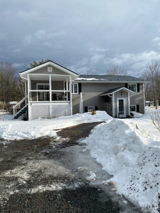 Deep Charcoal Interlock Cedar Shingle aluminum roof on the home, Centreville, Nova Scotia