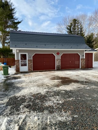 Deep Charcoal Interlock Cedar Shingle aluminum roof on the home, Centreville, Nova Scotia