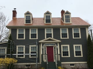 Copper Penny Interlock Slate aluminum roof on the home with chimney, Granville Ferry, Nova Scotia