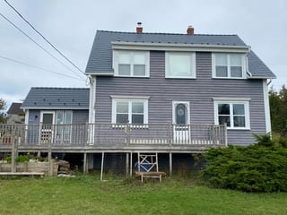 Deep Charcoal Interlock Cedar Shingle aluminum roof on the home, Kingsburg, Nova Scotia