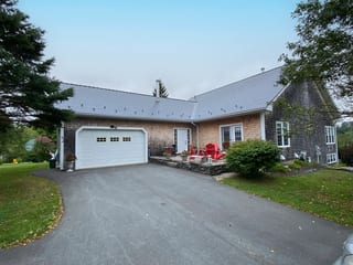 Deep Charcoal Interlock Cedar Shingle aluminum roof on the home with ridge cap and roof louver, Chester Basin, Nova Scotia