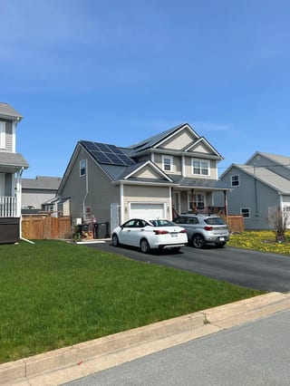 Deep Charcoal Interlock Slate aluminum roof on the home with solar panels, Eastern Passage, Nova Scotia