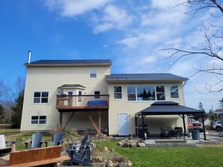 Black Interlock Slate aluminum roof on the home with ridge cap, Hammonds Plains, Nova Scotia