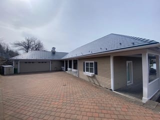 Deep Charcoal Interlock Slate aluminum roof on the home, Lunenburg, Nova Scotia