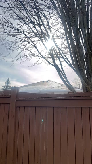 Tudor Brown Interlock Slate aluminum roof on a brown Tudor home with a metal roof in a rural area, Barrie, Ontario
