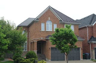Tudor Brown Interlock Cedar Shingle aluminum roof on a Tudor Brown Interlock roof on a two-storey brick colonial, Mississauga, Ontario