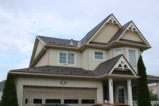 Tudor Brown Interlock Cedar Shingle aluminum roof on a Tudor-style home with a Tudor Brown metal roof in, Shelburne, Ontario