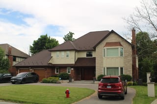 Colonial Brown Interlock Cedar Shingle aluminum roof on a two-storey home with a metal roof in a suburban setting, Mississauga, Ontario