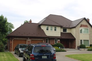 Colonial Brown Interlock Cedar Shingle aluminum roof on a Colonial home with a brown roof among suburban homes, Mississauga, Ontario