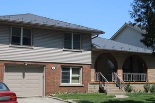 Musket Grey Interlock Cedar Shingle aluminum roof on a single-storey home with a metal roof in a suburban setting, Guelph, Ontario