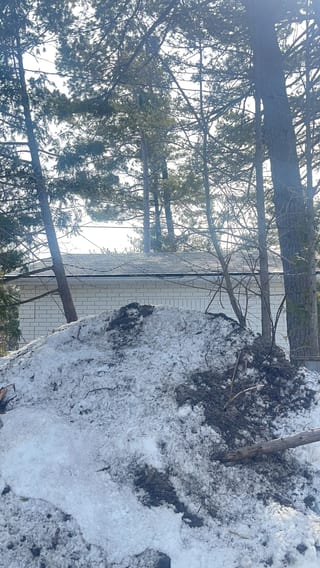 Deep Charcoal Interlock Slate aluminum roof on a white single-family home in a suburban neighbourhood with, Wasaga Beach, Ontario
