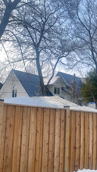 Deep Charcoal Interlock Slate aluminum roof on a two-storey modern home with a deep charcoal metal roof in, Wasaga Beach, Ontario