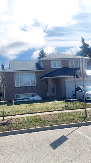 Deep Charcoal Interlock Slate aluminum roof on a two-storey home with brick exterior in a suburban, Bradford, Ontario