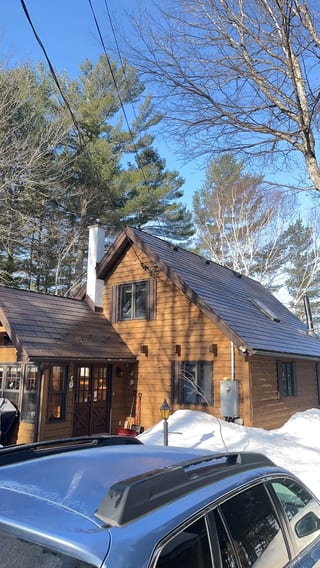 Colonial Brown Interlock Cedar Shingle aluminum roof on a Colonial Brown metal roof on a chalet in a forested, Algonquin Highlands, Ontario