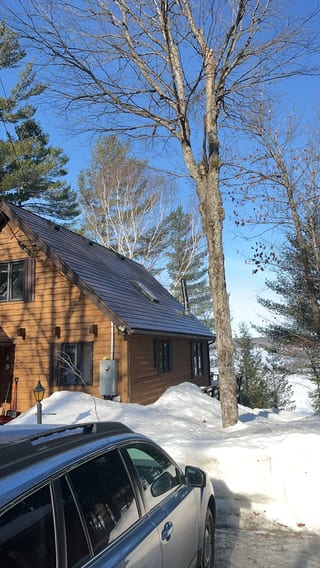 Colonial Brown Interlock Cedar Shingle aluminum roof on a Colonial brown metal roof on a two-storey home in the, Algonquin Highlands, Ontario