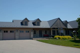 Musket Grey Interlock Cedar Shingle aluminum roof on a ranch-style home with a Musket Grey metal roof in a rural, Guelph, Ontario