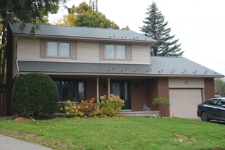 Musket Grey Interlock Cedar Shingle aluminum roof on a two-storey colonial style home with a garage in a, Kitchener, Ontario