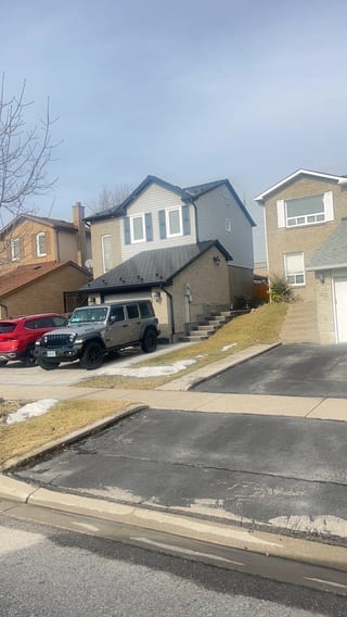 Black Interlock Slate aluminum roof on a two-storey home with a black Interlock Slate metal roof, Brampton, Ontario