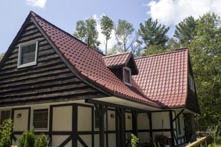 Tile Red Interlock Tile aluminum roof on a red metal roof on a cottage in the forest by the lake, Gravenhurst, Ontario