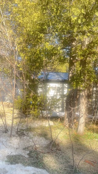 Black Interlock Slate aluminum roof being installed on a metal roof being installed on a home in the Blue Mountains, The Blue Mountain, Ontario