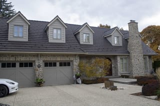 Tudor Brown Interlock Shake aluminum roof on a brown two-storey home with dormers in an urban, Waterloo, Ontario