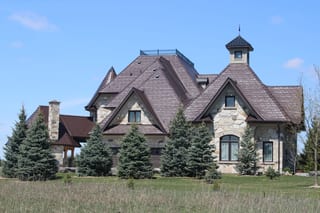 Colonial Brown Interlock Slate aluminum roof on a colonial home with a brown metal roof in a rural setting, Caledon, Ontario