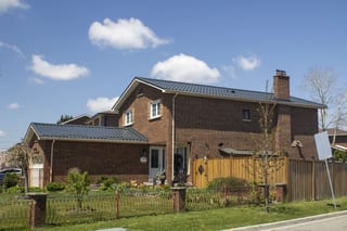 Deep Charcoal Interlock Tile aluminum roof on a two-storey home with a metal roof in Etobicoke, Ontario, Etobicoke, Ontario